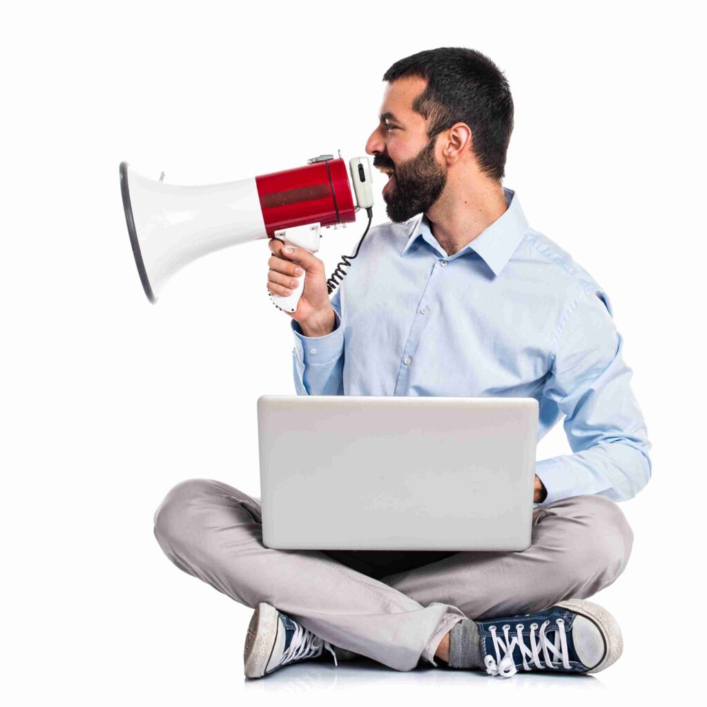 Man with laptop shouting by megaphone 11zon 1024x1024